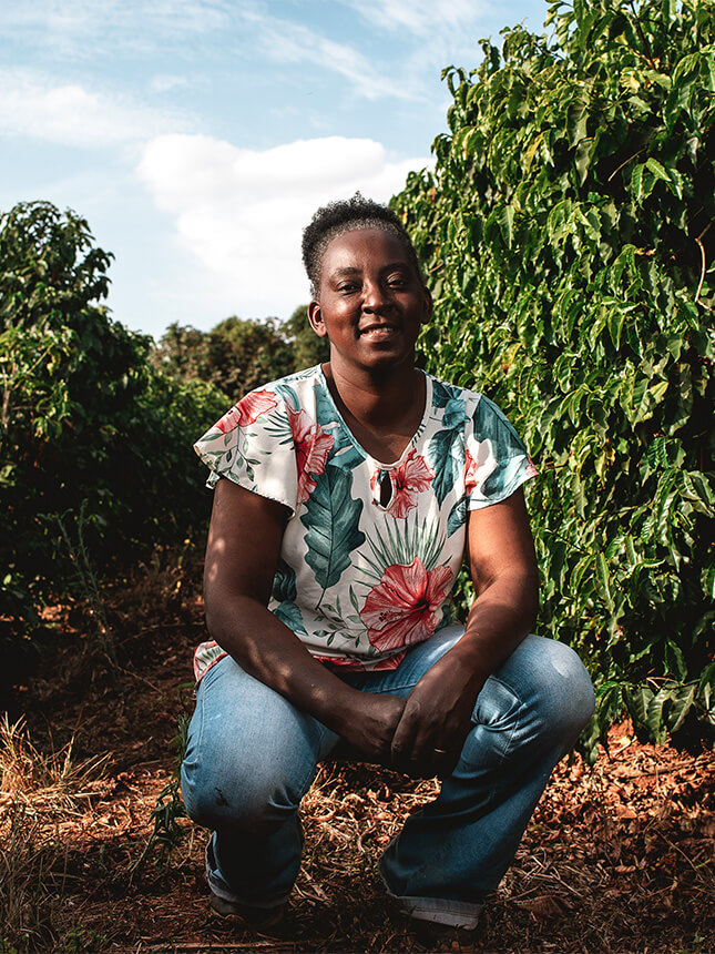A woman at a coffee plantation