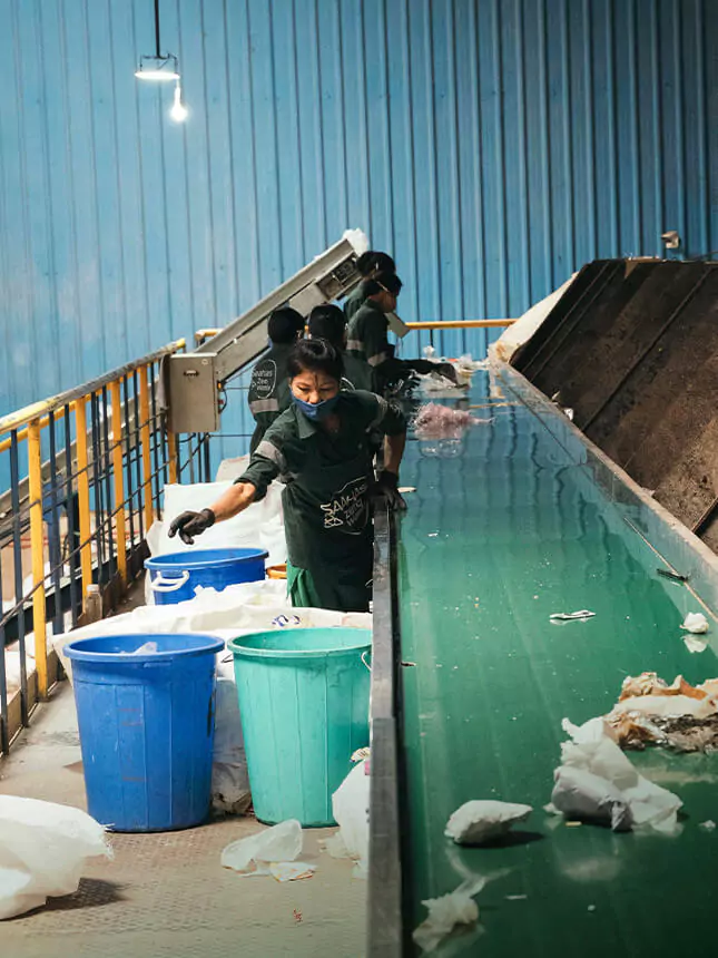 A woman sorting waste