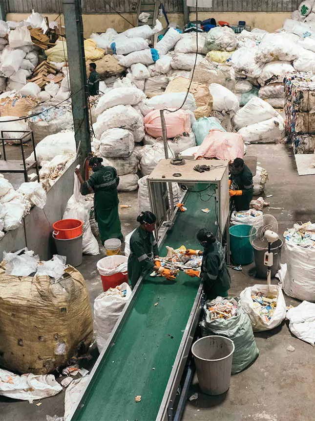 A group of people sorting waste