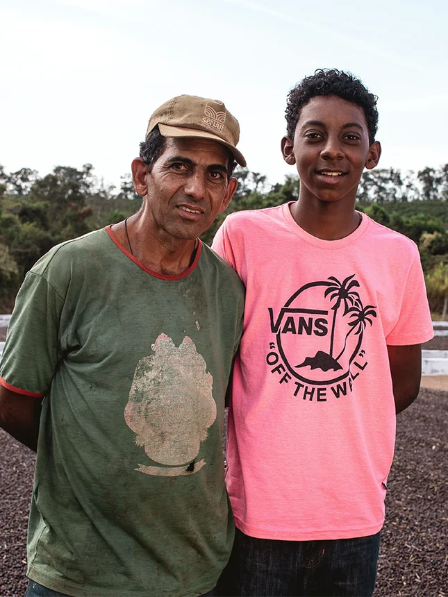 Two men on a plantation, smiling (Photo)