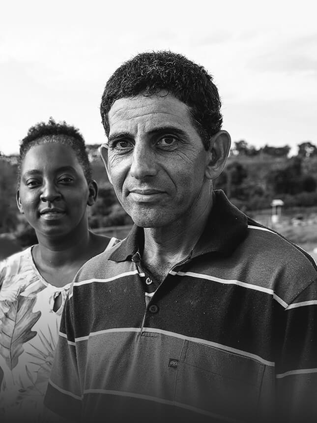 A woman and a man are looking at the camera