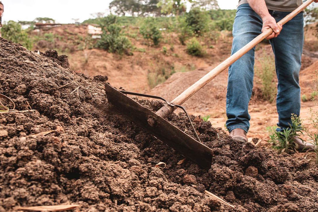 Fertilizer being pushed to a pile